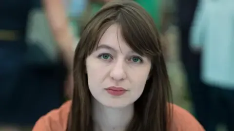 Irish author Sally Rooney states she is unable to enter the UK because of potential arrest